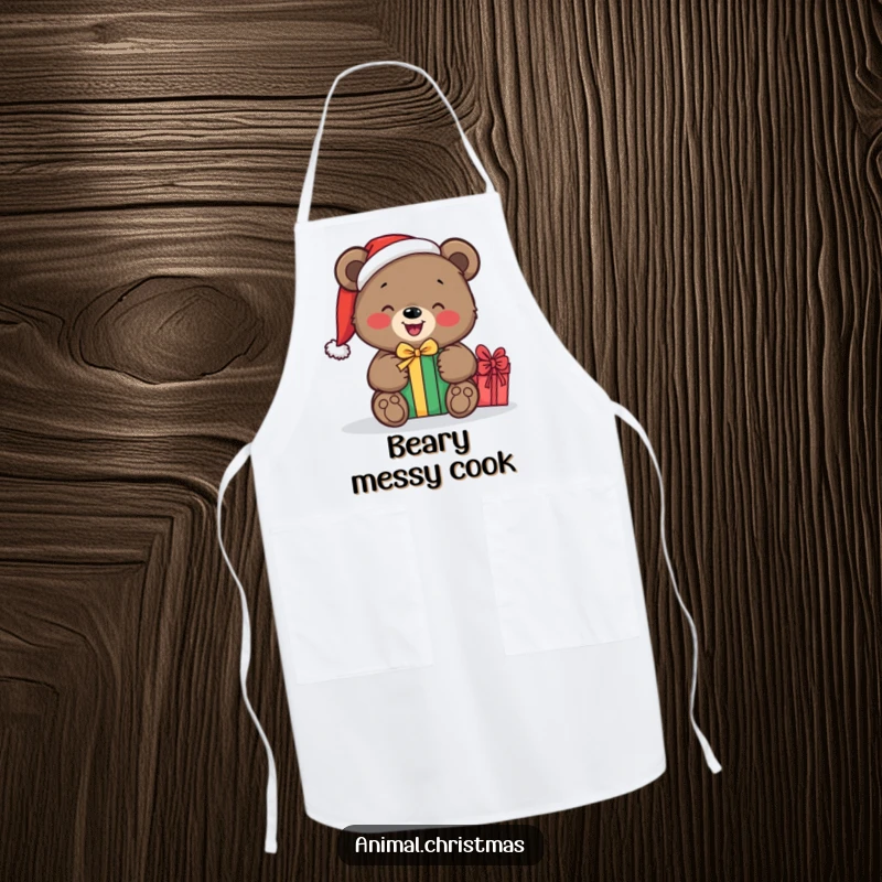 Funny apron depicting a bear in a Santa hat, happily unwrapping a gift while cooking, bringing holiday cheer to the kitchen.