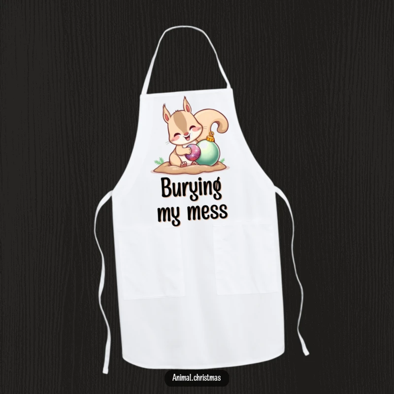 Funny apron showcasing a happy squirrel burying a shiny ornament, perfect for kitchen fun and holiday baking.