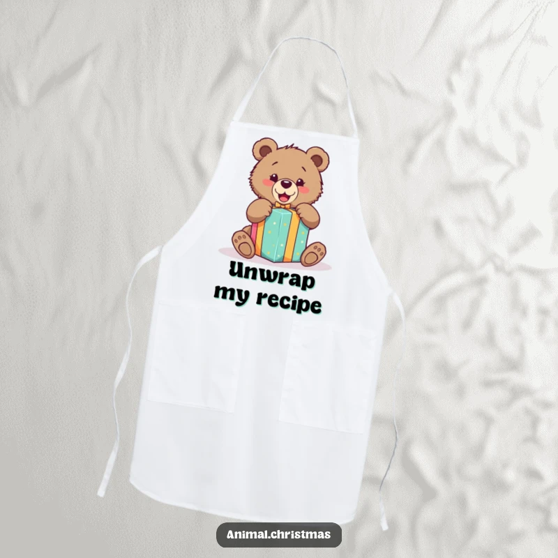 Funny apron of an excited bear cub unwrapping a brightly colored gift, ideal for adding fun to kitchen activities.