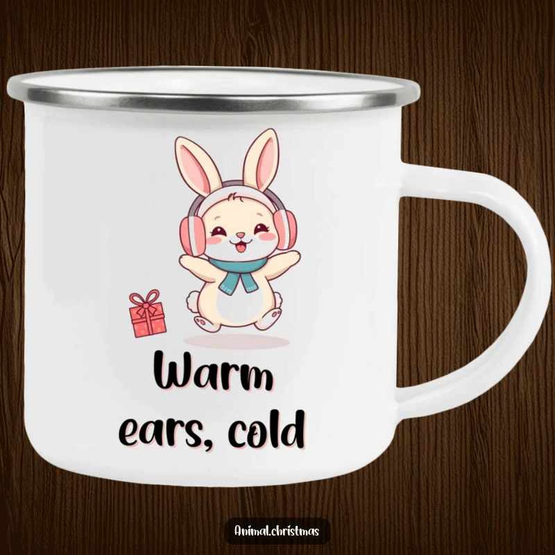 Funny camping mug with a rabbit wearing earmuffs, hopping with festive cheer, ideal for outdoor lovers.