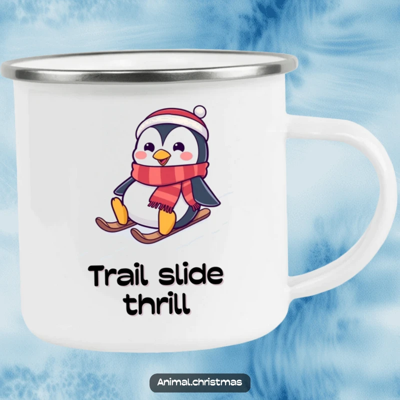Funny camping mug featuring a penguin wearing a festive scarf, joyfully sliding down a snowy hill, ideal for outdoor holiday enjoyment.