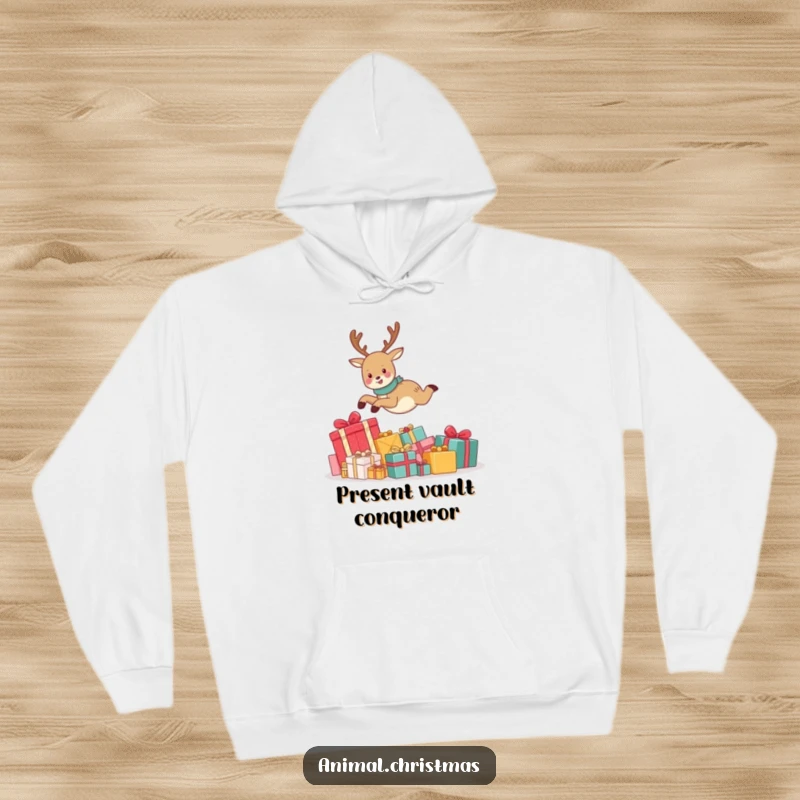 Funny hoodie depicting a cute reindeer joyfully leaping over a huge stack of wrapped Christmas gifts, radiating festive cheer and warmth.