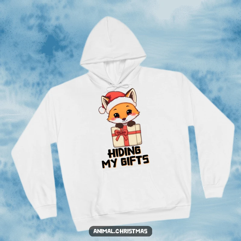 Funny hoodie with a fox wearing a tiny Santa hat, peeking from behind a present, combining warmth and holiday humor.