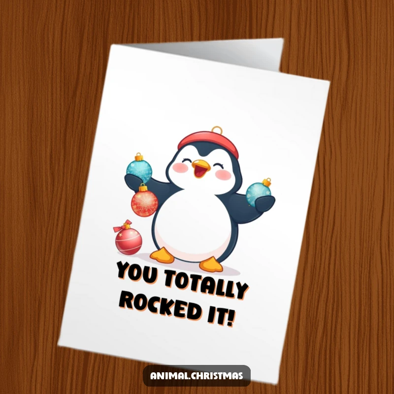 Free Printable Congratulations Card: A beaming plump penguin tries to juggle three shiny Christmas baubles with enthusiasm.