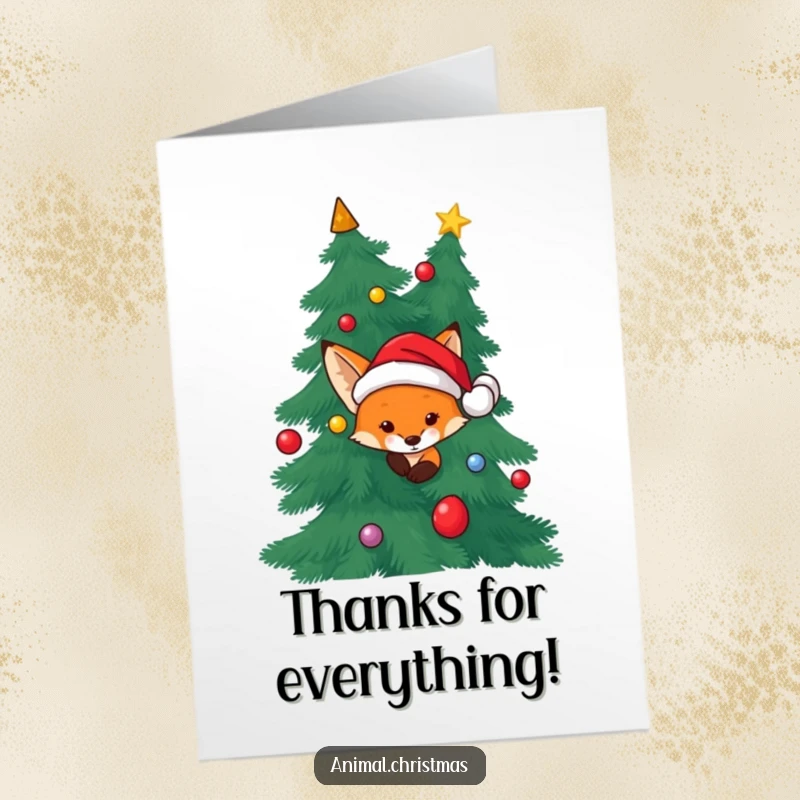 Funny Free Printable Thank You Card: A fox wearing a Santa hat peeks from behind a Christmas tree, offering thanks.