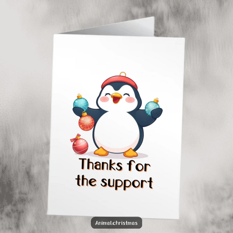 Funny Free Printable Thank You Card: A plump penguin beams while juggling three shimmering Christmas baubles, a fun thank you.