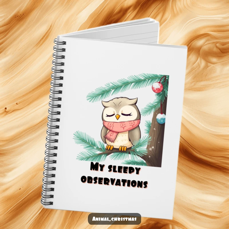 Funny Christmas notebook featuring a sleepy owl wearing a knitted scarf, nestled inside a frosted pine tree.