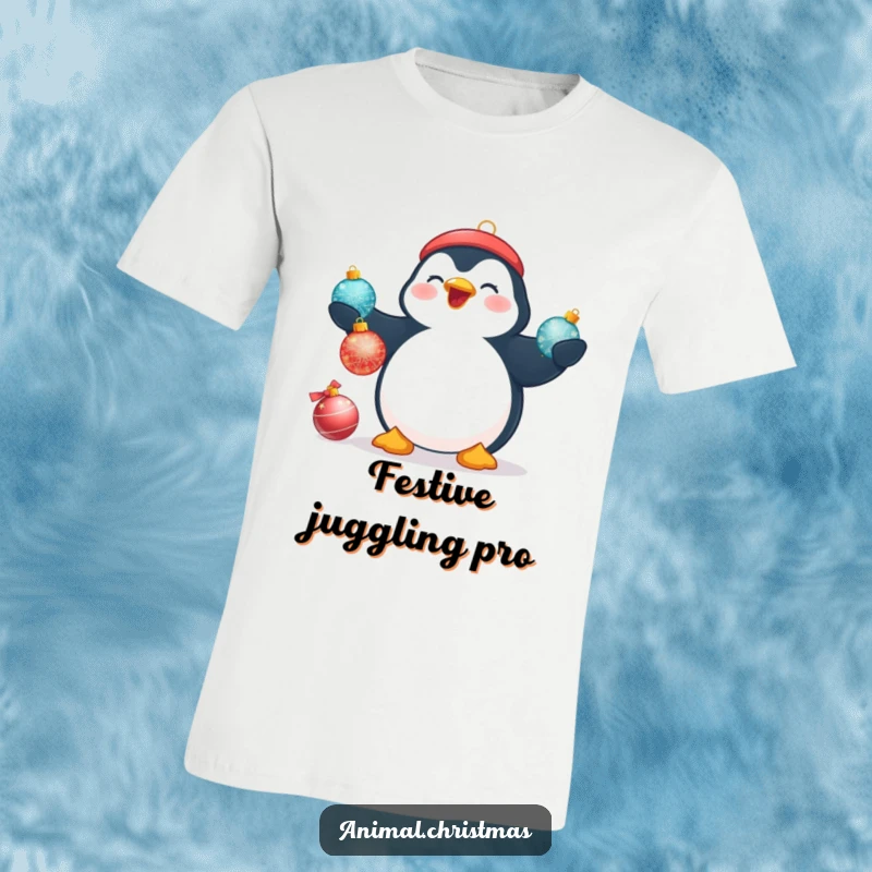 Funny Christmas t-shirt depicting a plump penguin with a big smile, attempting to juggle three shimmering Christmas baubles.