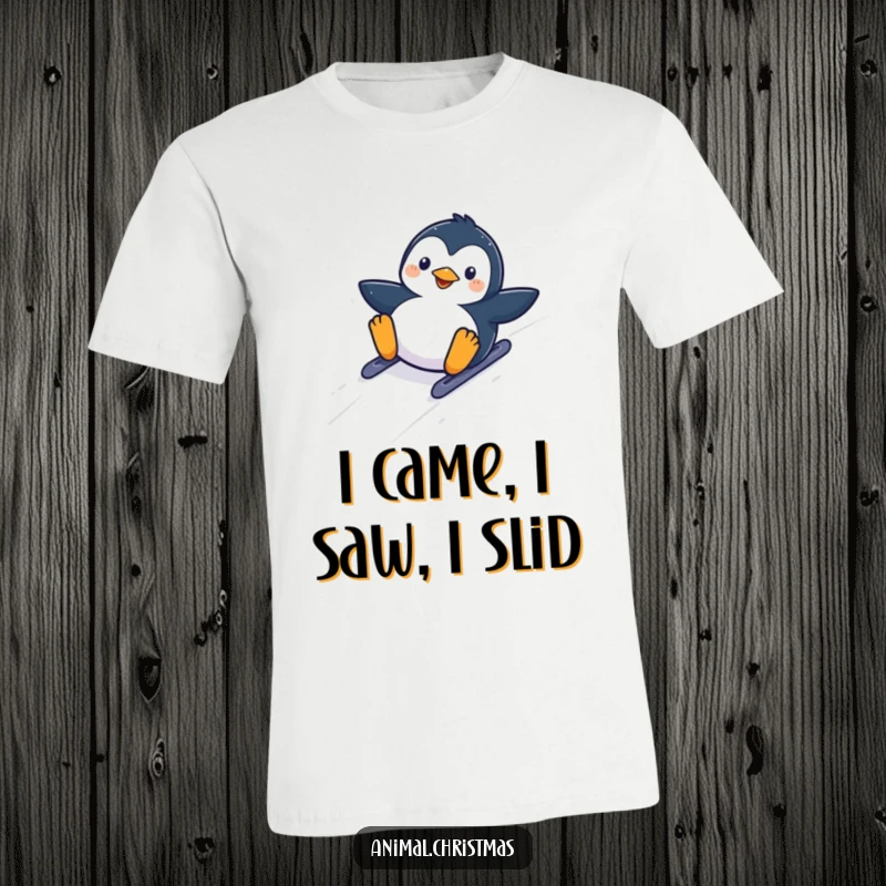 Funny kawaii penguin sliding down a snowy hill with glee on a comfortable t-shirt.