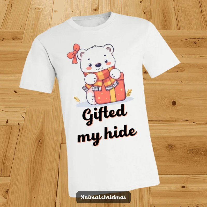 Funny t-shirt depicting a cute polar bear wearing a scarf, curiously peeking from behind a large, festive present.