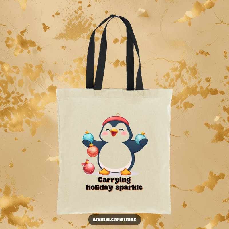 Funny Christmas tote bag featuring a plump penguin beaming while attempting to juggle three shimmering Christmas baubles.